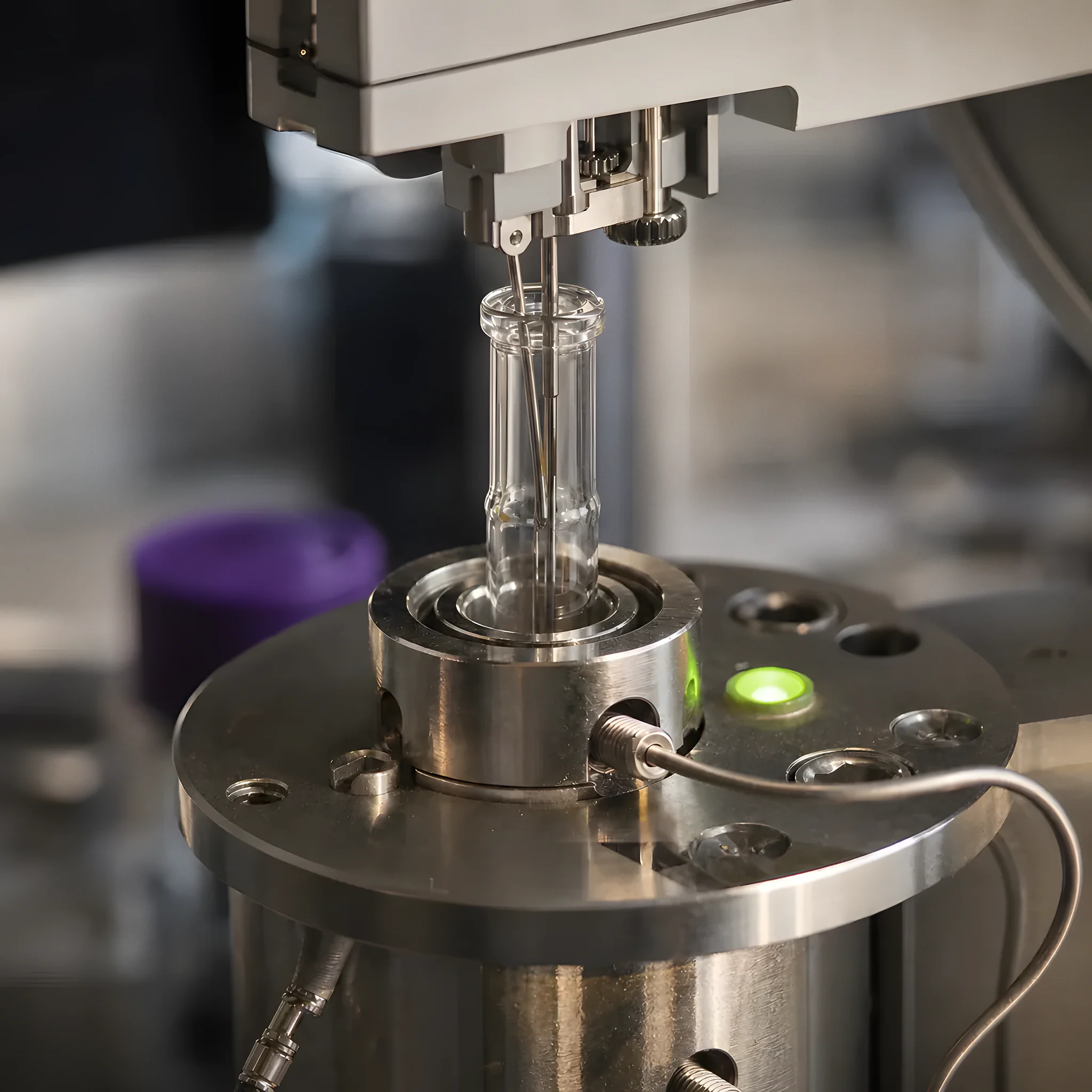 Close-up of a gas chromatograph injection port in the analytical lab